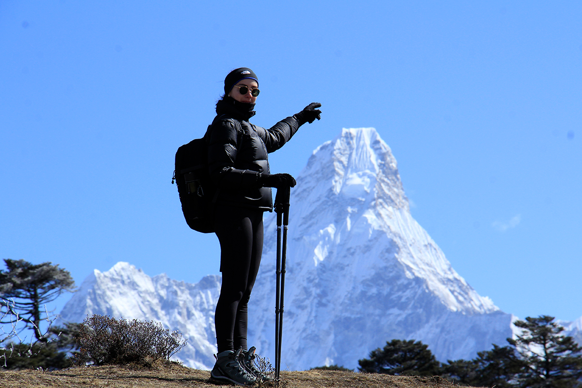 Ama Dablam viewed on background of a trekker climbing to EBC